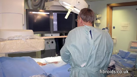 Dr. Walker in the operating theater performing a uterine artery fibroid embolisation procedure.